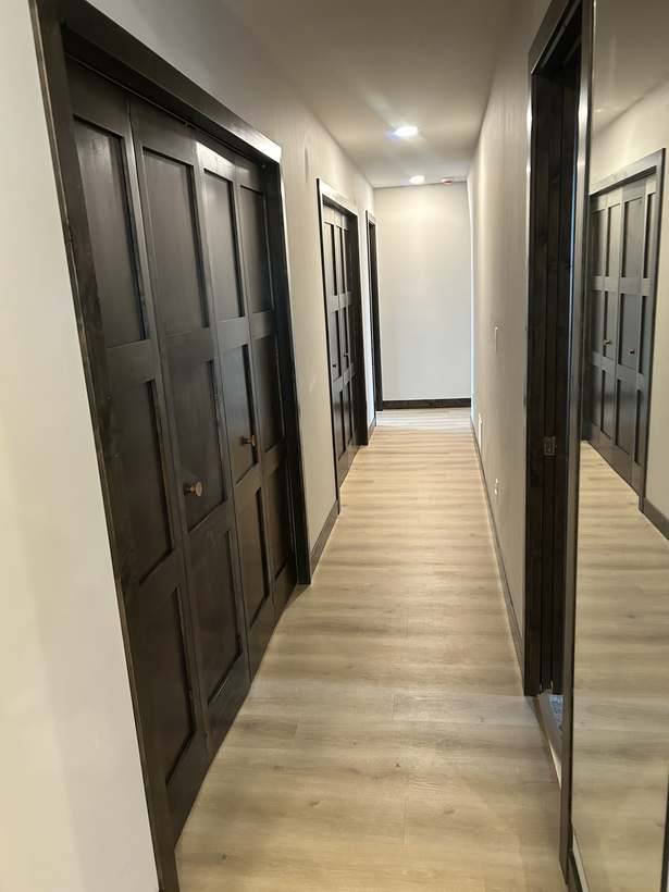 The finished hallway connecting to the rest of the upstairs
