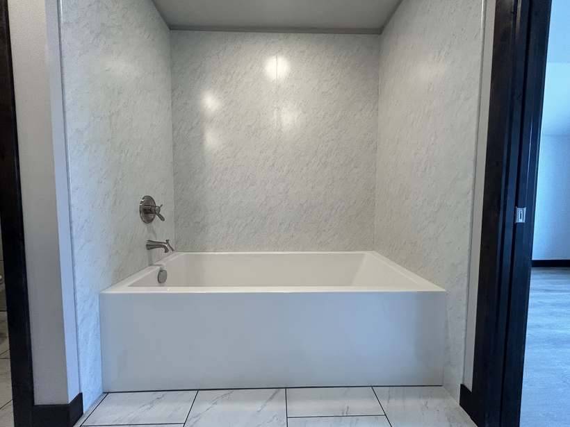 The finished soaking tub in the ensuite bathroom