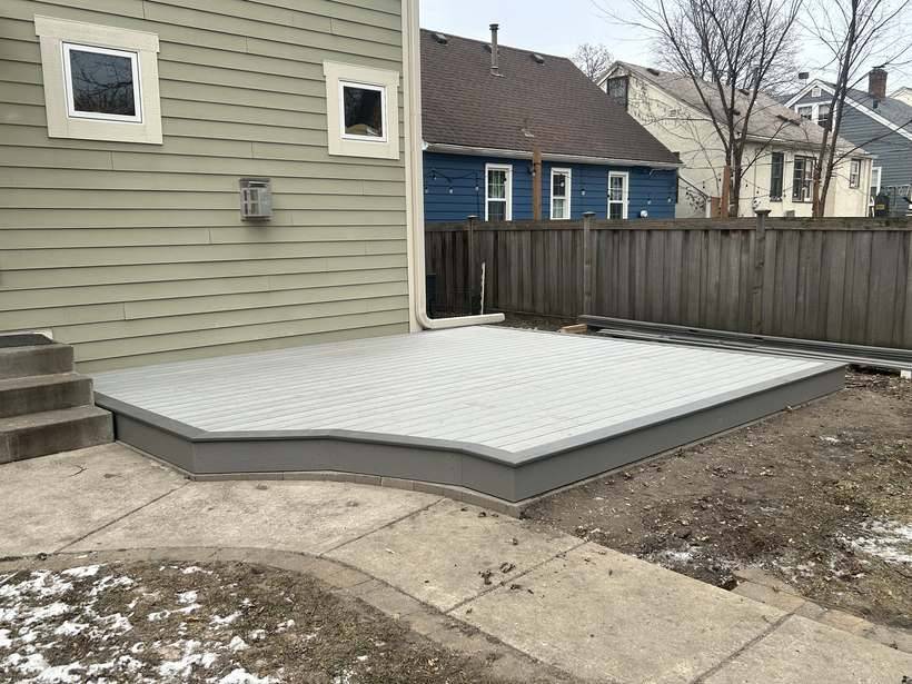 Finished composite deck in St. Cloud, MN with an angled corner and picture frame border