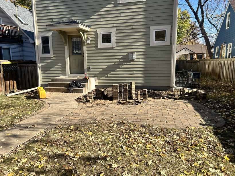 The existing paver patio in St. Cloud, MN before the new composite deck