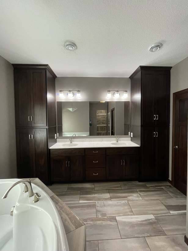 The double vanity with custom cabinets