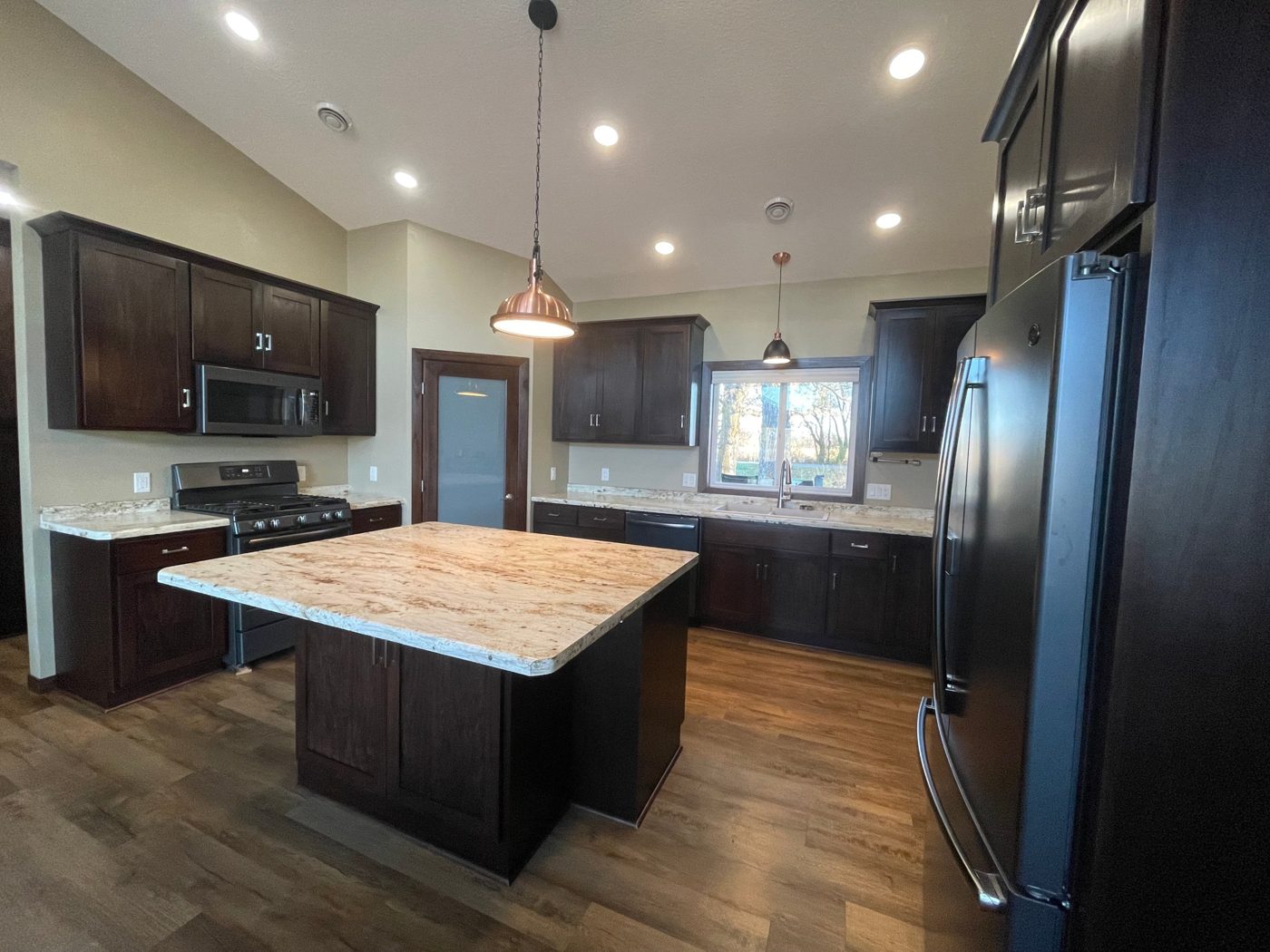 The finished kitchen seen from beside the refrigerator