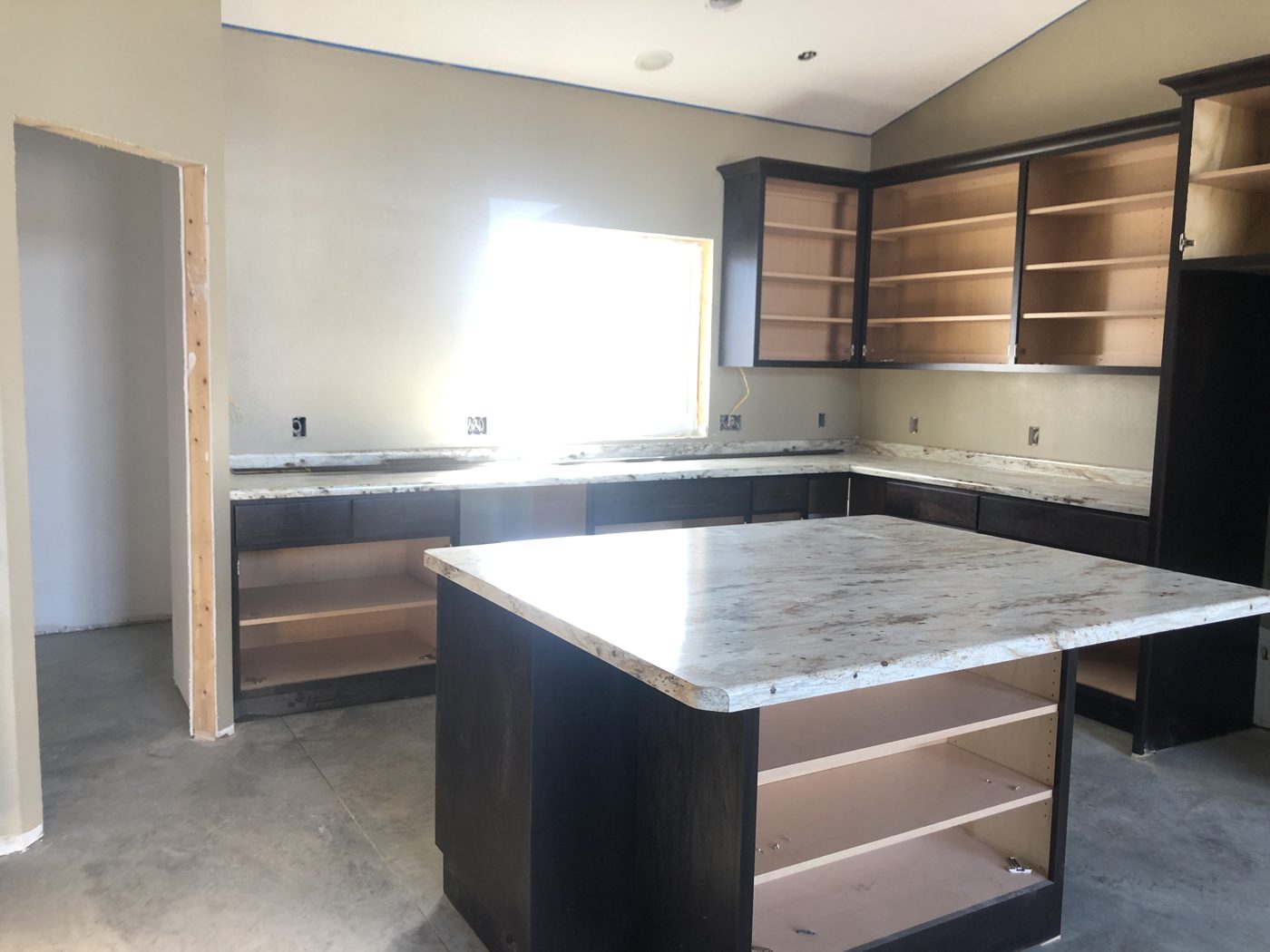 Laminate countertops and island top installed before the cabinet doors went on