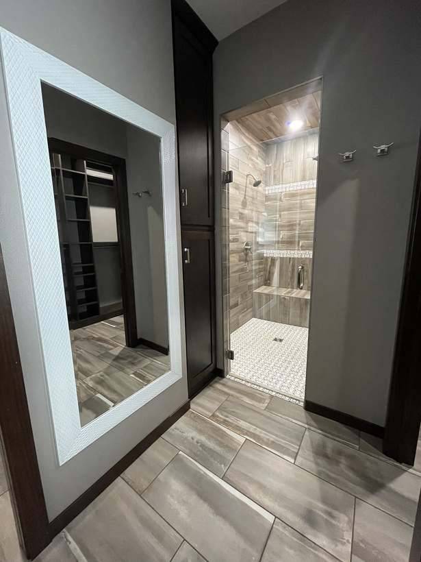 Tile carried from the floor up the walls and across the ceiling