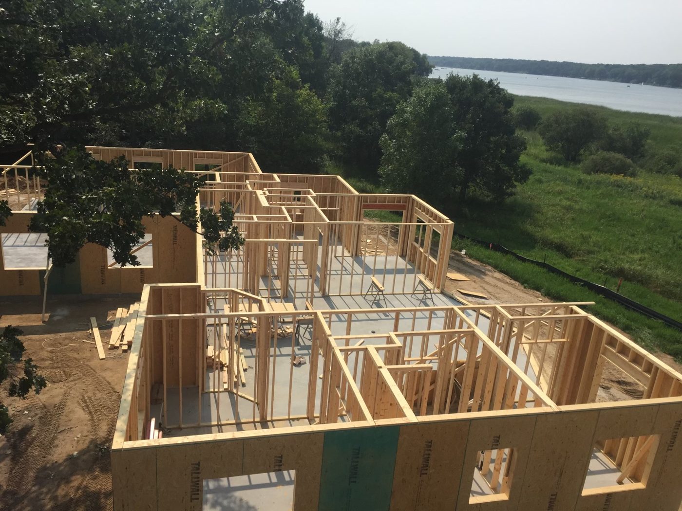 Wall framing going up on our own lakeside home, the house from our story